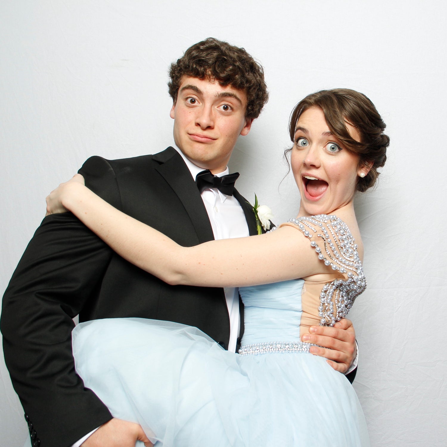 Wedding Photo Booth Pose with Groom Holding Bride