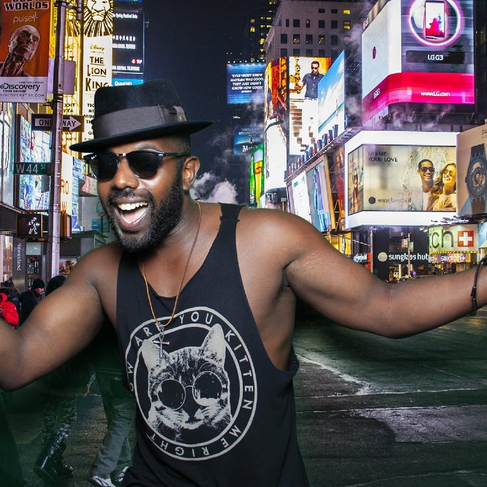 Man posing in a photo booth in Times Square New York City