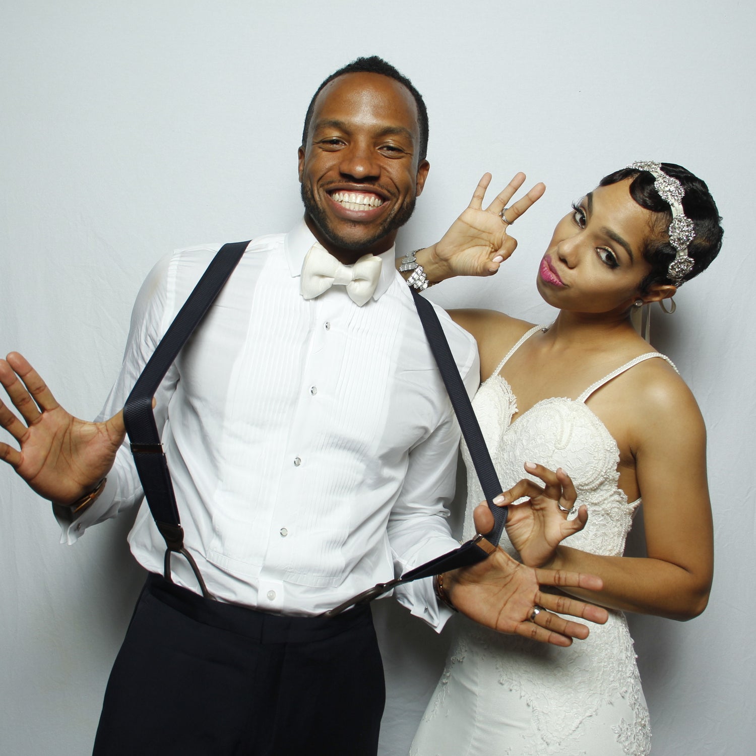 Bride and Groom Posing in a Wedding Photo Booth
