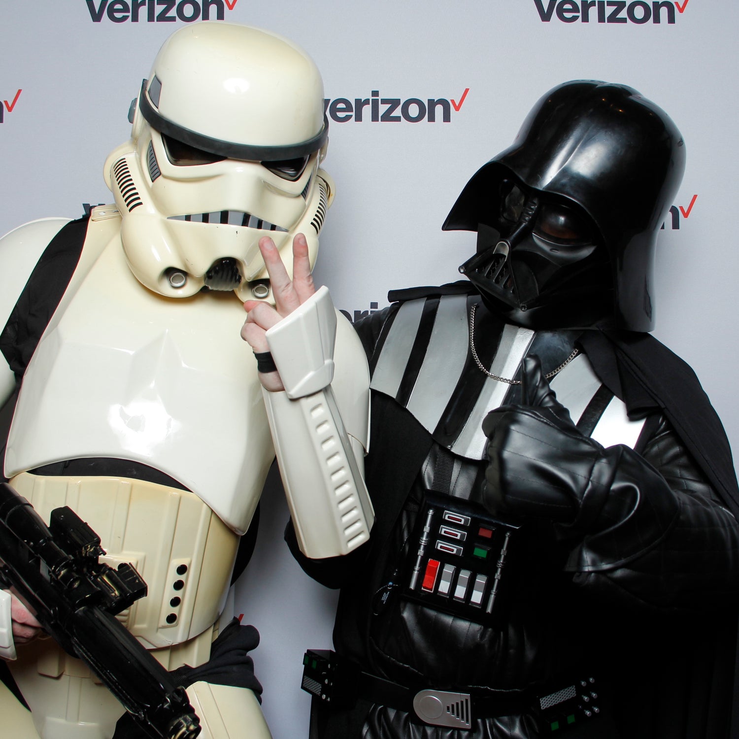 Darth Vader and a Storm Trooper posing in a Verizon Photo Booth at a Halloween Party