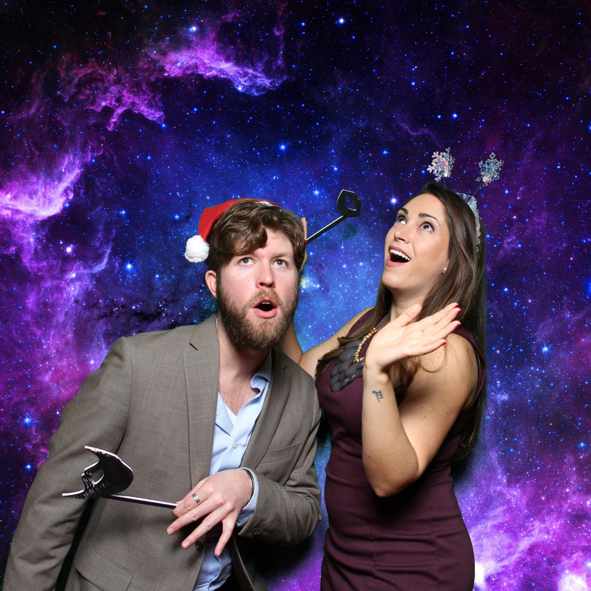 Green Screen Photo Booth Picture of Man and Woman Staring Off into Outer Space