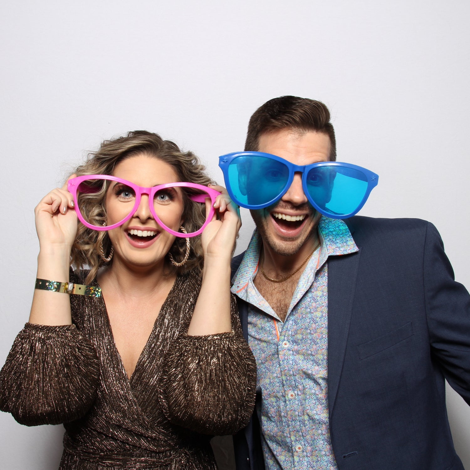 Houston Photo Booth picture of Couple with big silly glasses and 70s outfits