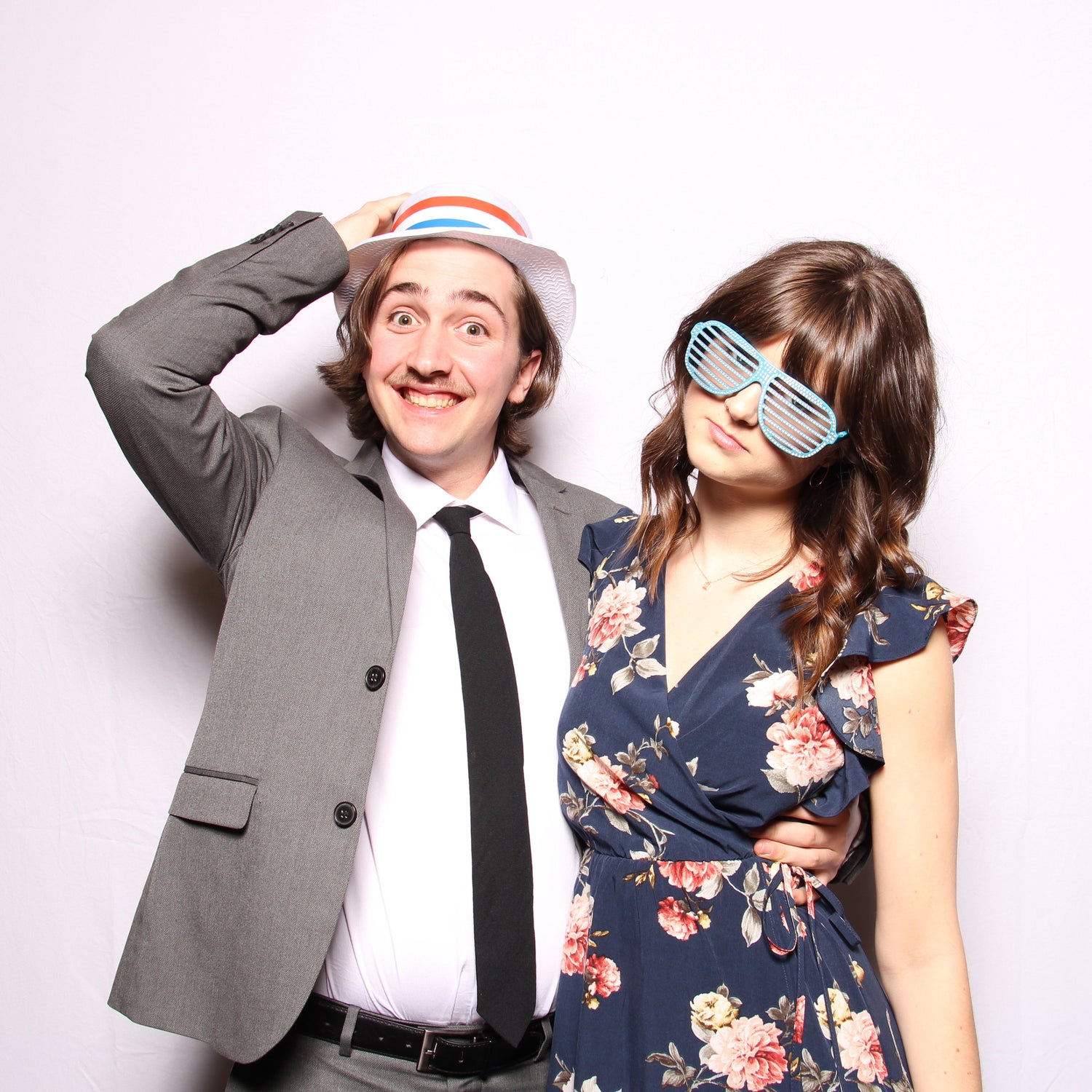 Young couple posing in a photo booth