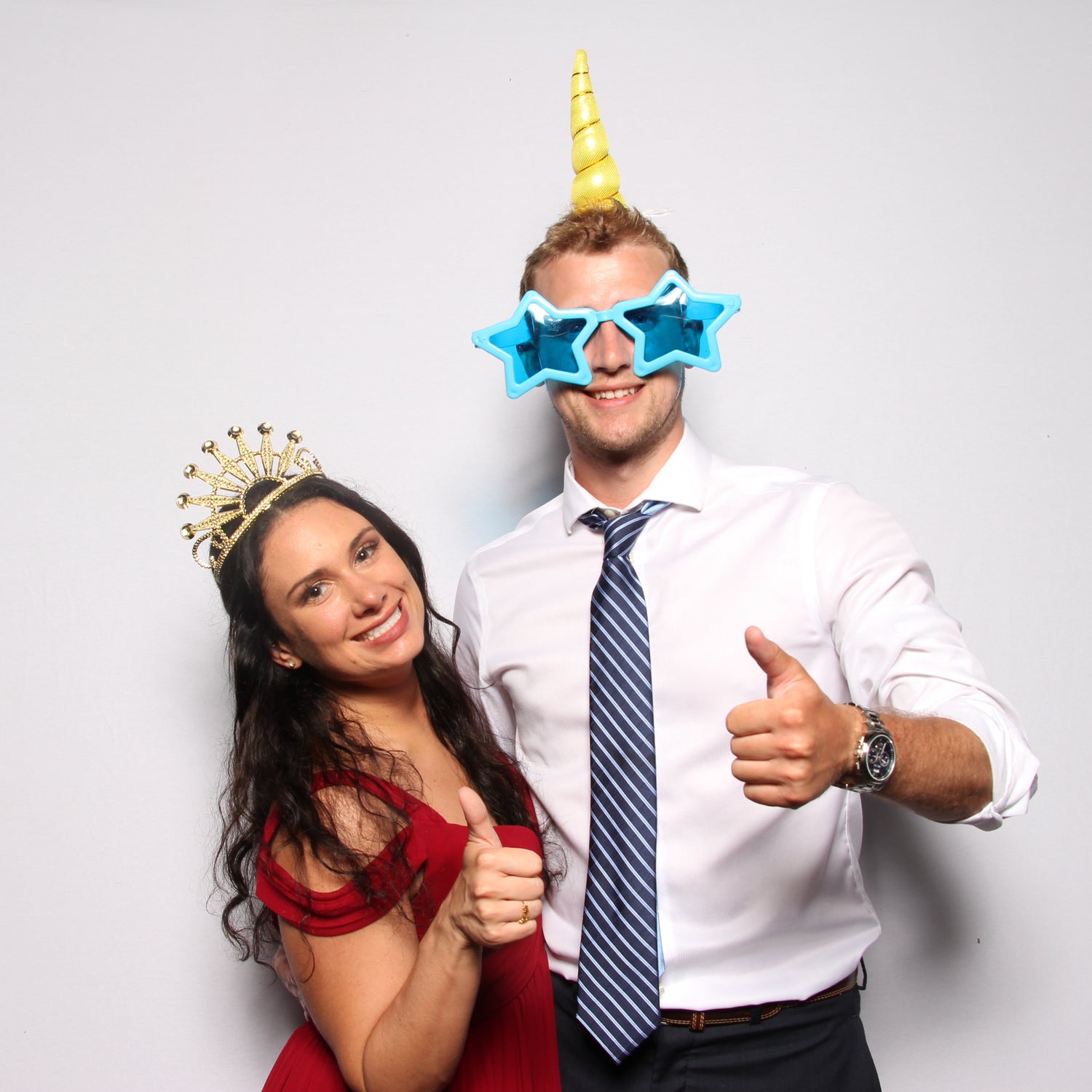 Charlotte Photo Booth picture of couple posing with props