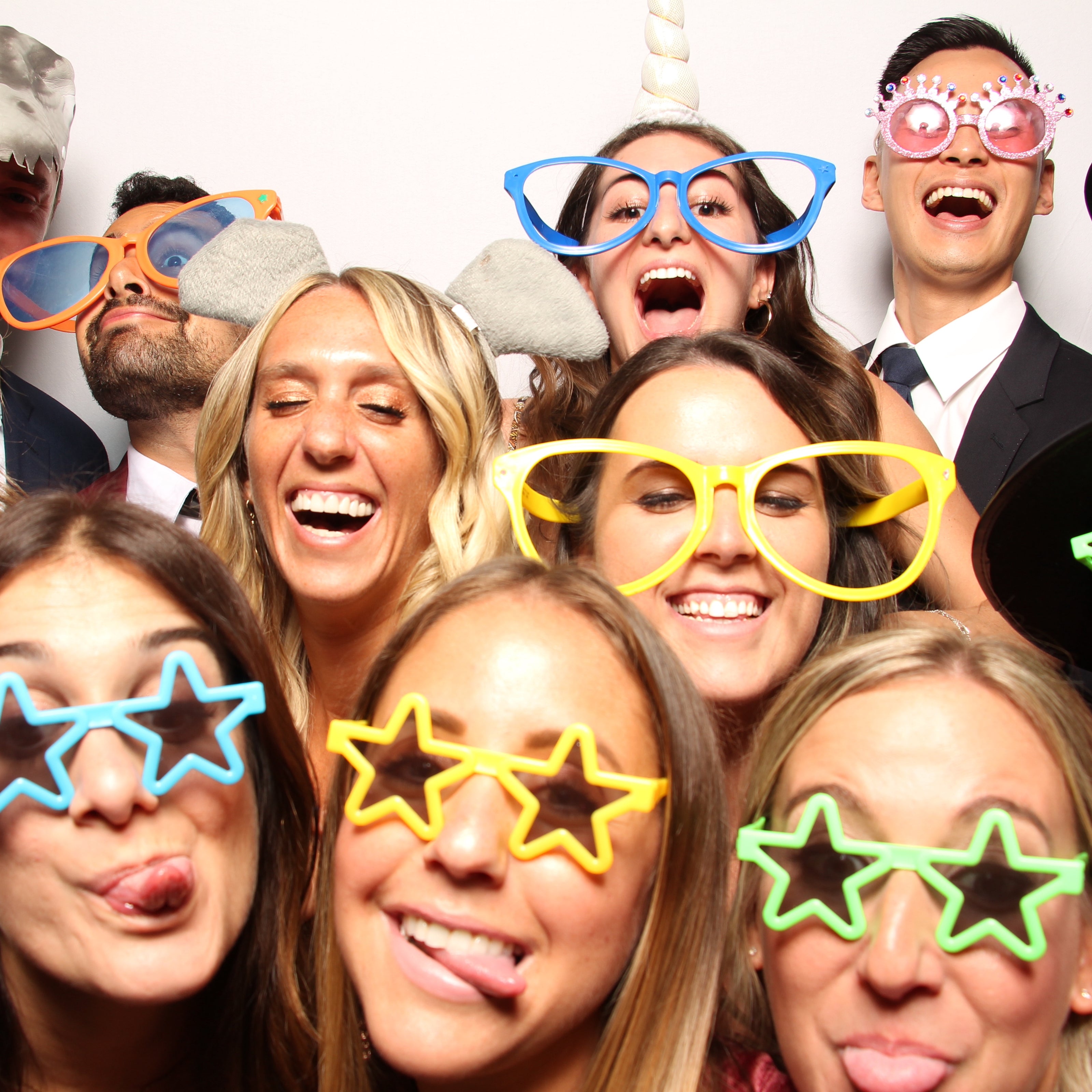 People acting silly in a photo booth in Atlanta