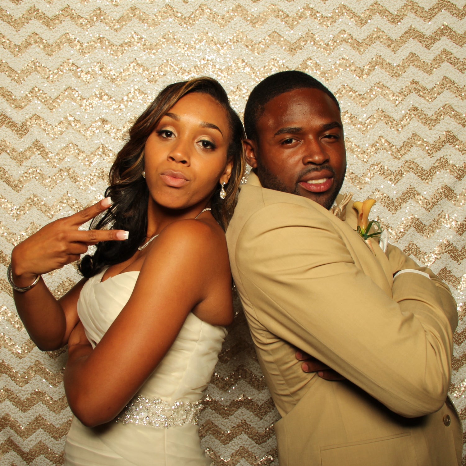 Chanel and Torrey Smith (Ex-Baltimore Ravens Wide Receiver) posing back-to-back in a Pixilated Photo Booth at their wedding